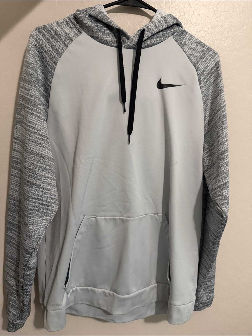 Nike Men's Light Gray Hoodie with Heathered Gray Sleeves and Black Drawstrings